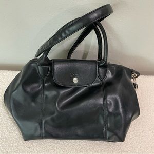 Longchamp La Pliage leather in black. New, never used.